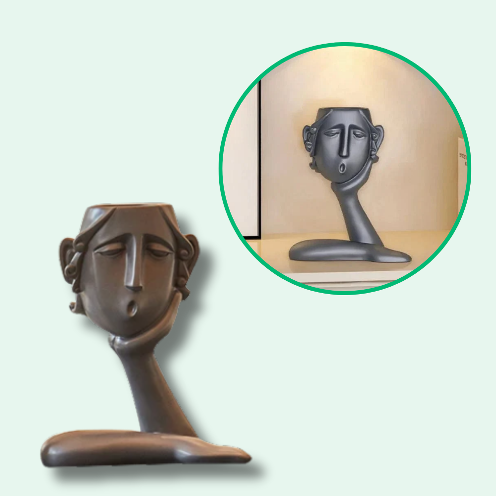 Vaso da fiori con eleganti volti artistici