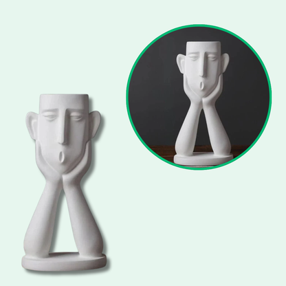 Vaso da fiori con eleganti volti artistici